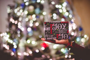 Employee Gift Guide in front of a christmas tree